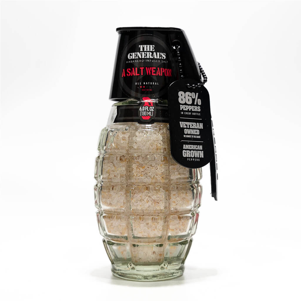 Glass grenade-shaped container filled with natural habanero-infused salt labeled 'The General's Salt Weapon' with information tag indicating 86% peppers and Veteran owned.